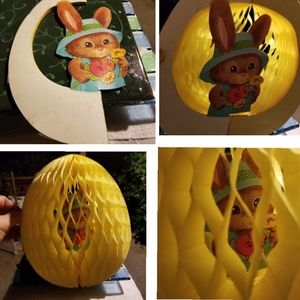 Old fold out paper rabbit in an egg